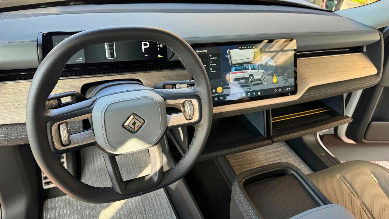 Interior cabin of the Rivian R2 electric SUV with minimalist dashboard and large touchscreen